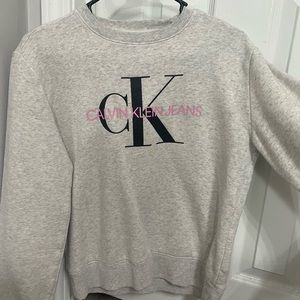 Grey Calvin Klein crewneck with pink and black lettering